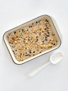 wild blueberry oatmeal mixture in baking dish before baking