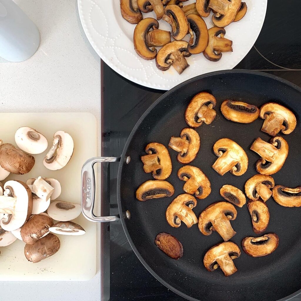Sautéing sliced mushrooms for linguine ai funghi mushroom pasta