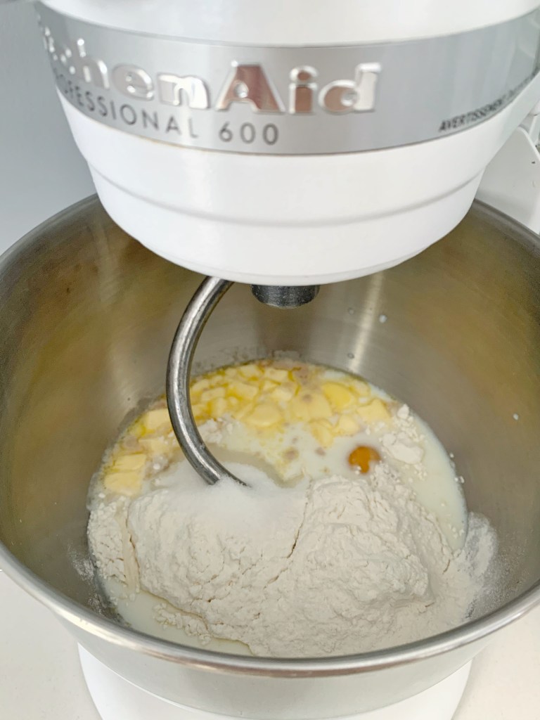 Mixing ingredients for pane di Pasqua Italian Easter bread dough in a stand mixer