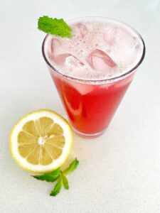 pink iced tea lemonade with ice and mint