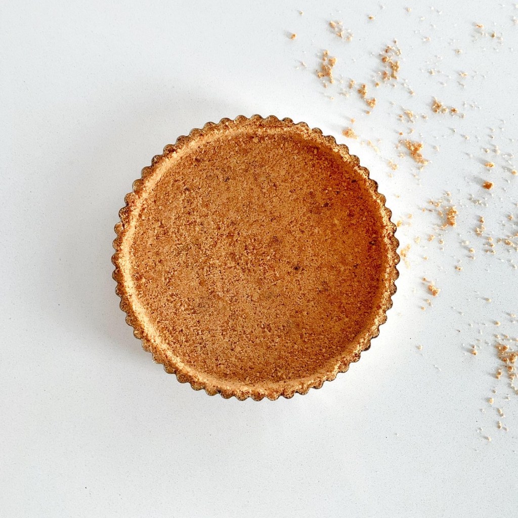 Homemade graham cracker pie crust baked and ready for pumpkin pie filling.