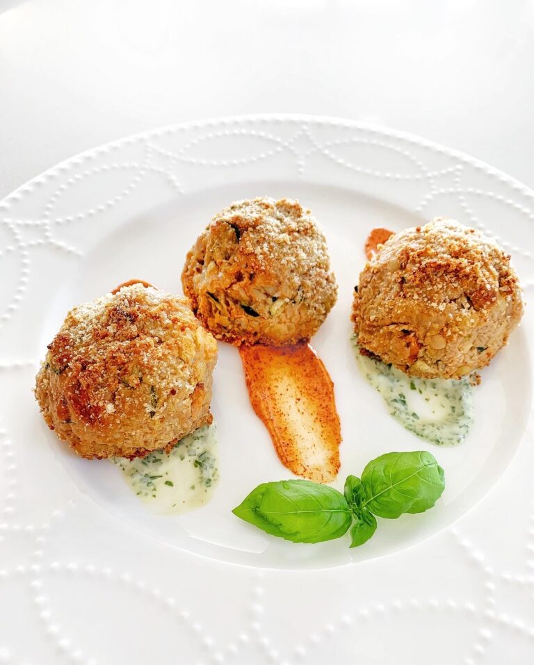 The best veggie ball recipe served crispy and golden with herb sauce and fresh basil