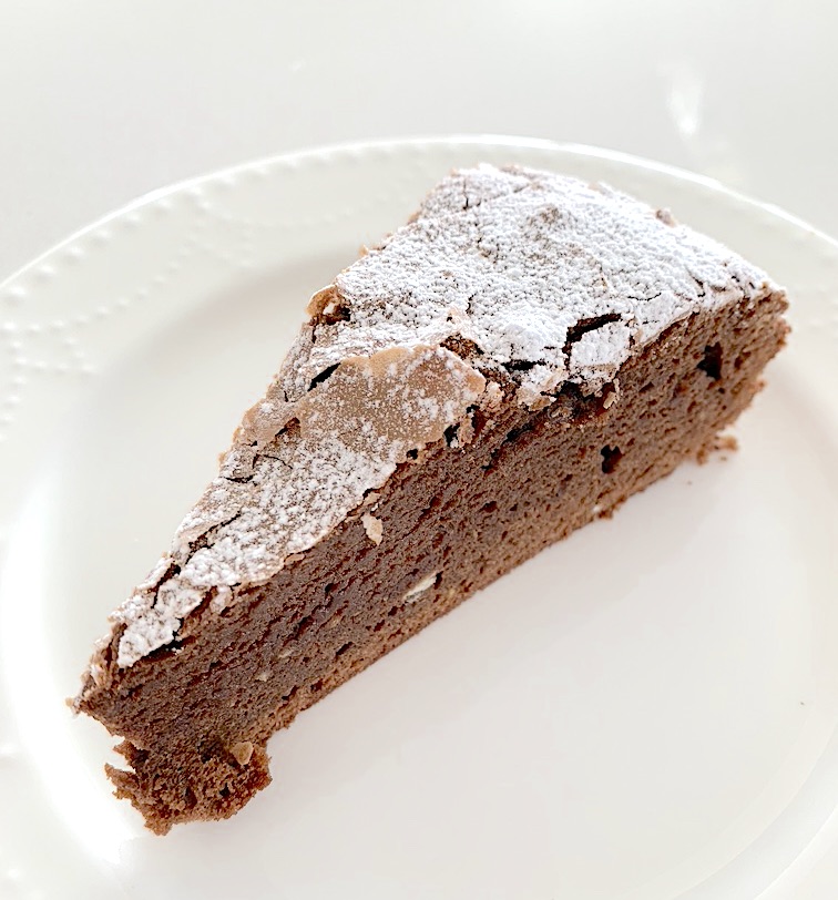 Slice of caprese chocolate almond cake