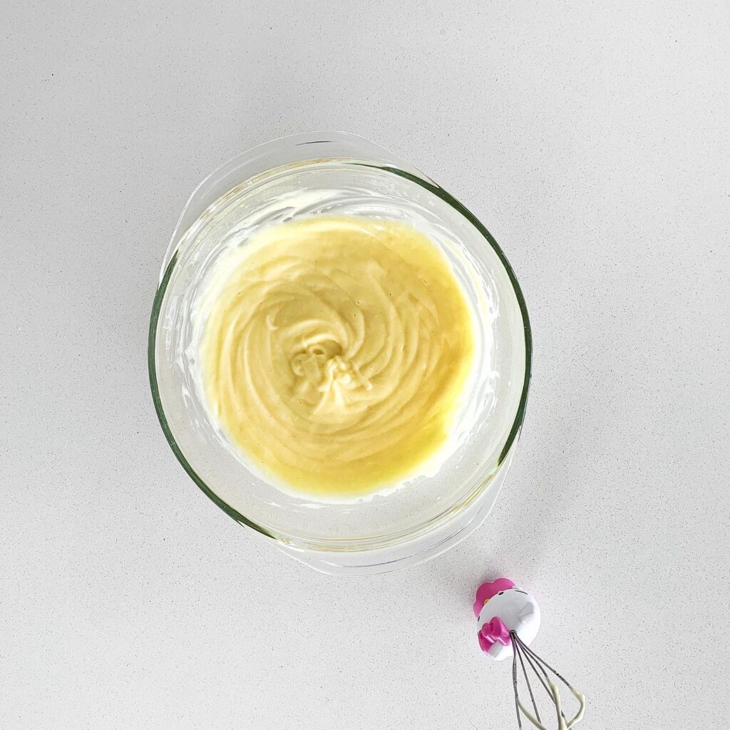 Whisking egg yolk with Dijon mustard and lemon juice for truffle aioli.